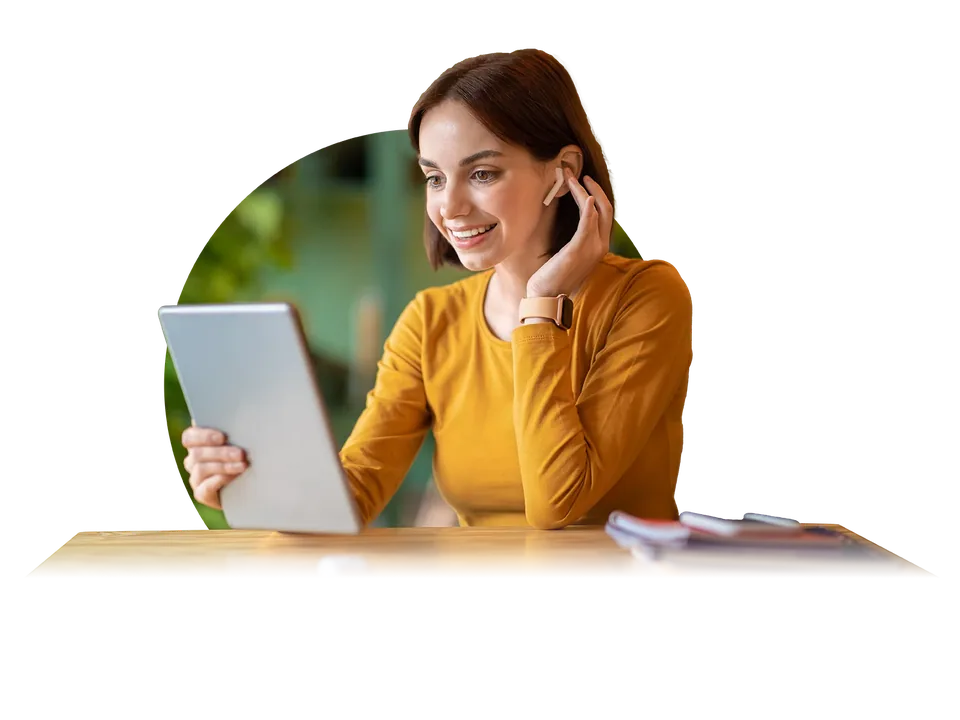 Event organizer smiling while using a tablet